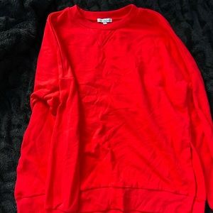 Red sweatshirt with side slits